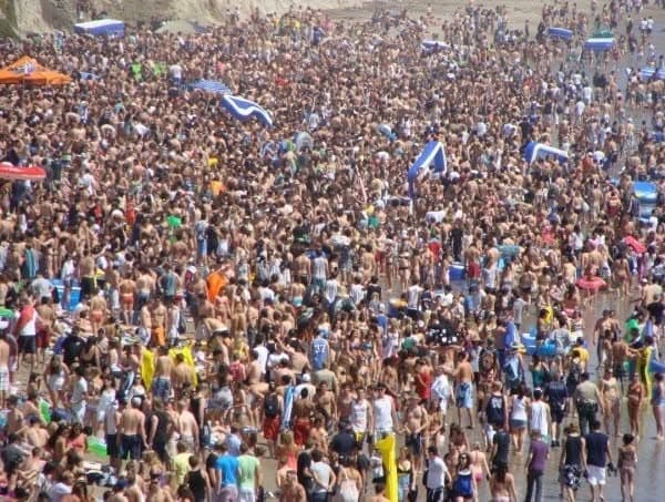 Floatopia — thousands of people packed on the beach in Isla Vista